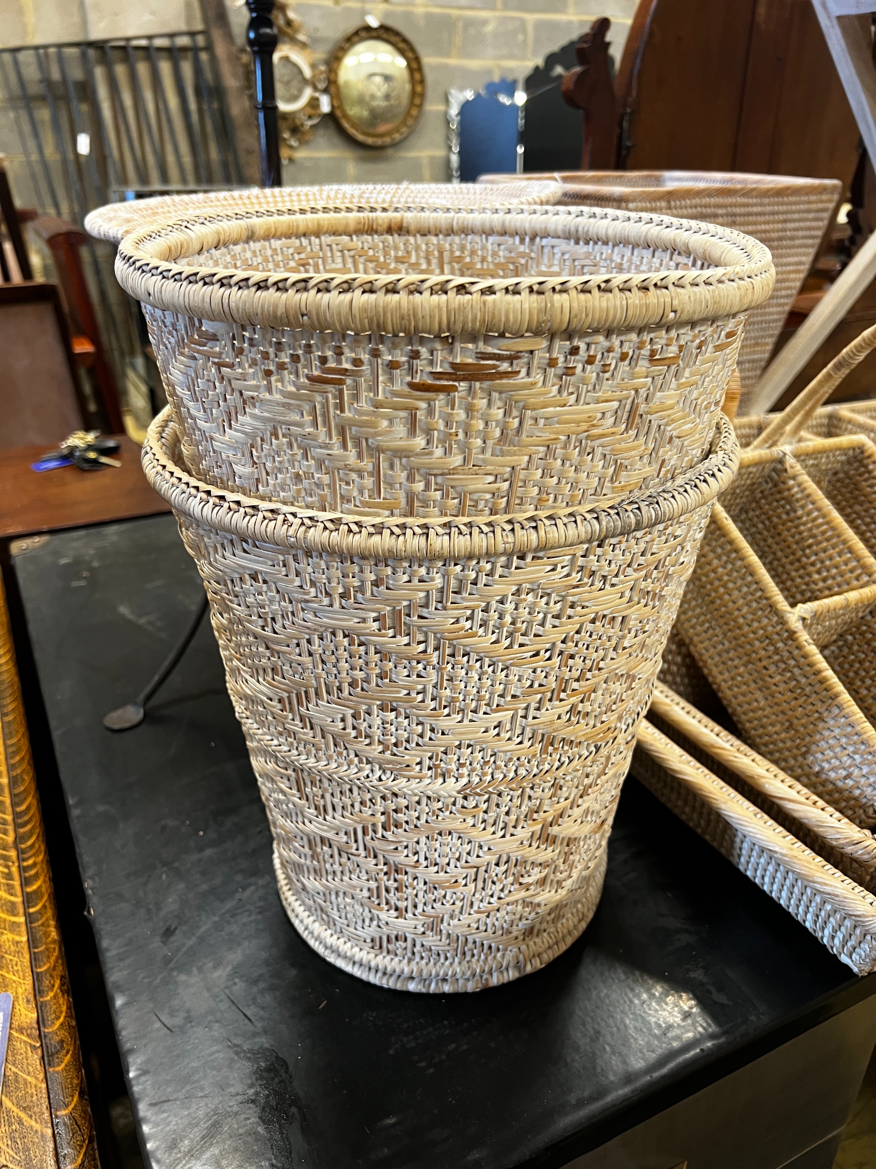 A wicker tray on folding stand together with nine other pieces of wickerwork